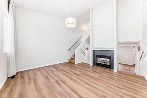 155 Prominence Heights Sw, Calgary, AB - Indoor With Fireplace