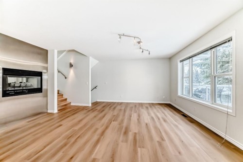 155 Prominence Heights Sw, Calgary, AB - Indoor With Fireplace