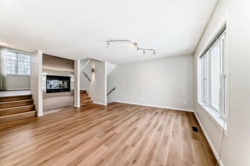 155 Prominence Heights Sw, Calgary, AB - Indoor Photo Showing Other Room With Fireplace