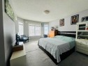 125 Saddlebrook Circle Ne, Calgary, AB  - Indoor Photo Showing Bedroom 