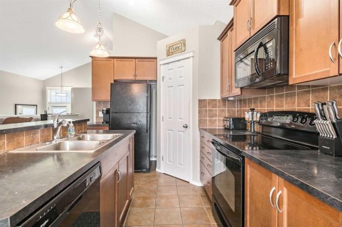 18 Copperstone Link Se, Calgary, AB - Indoor Photo Showing Kitchen With Double Sink