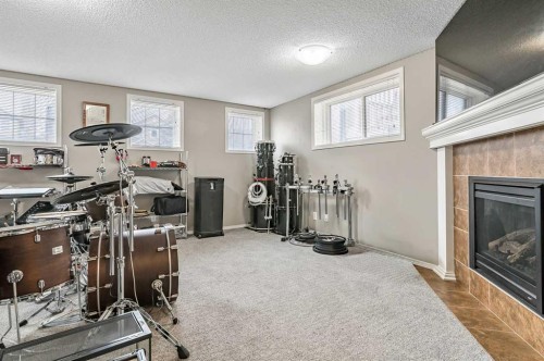 18 Copperstone Link Se, Calgary, AB - Indoor With Fireplace
