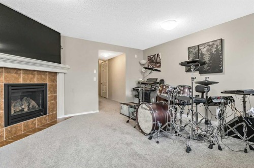 18 Copperstone Link Se, Calgary, AB - Indoor With Fireplace