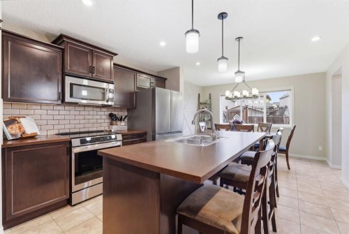 155 Copperpond Road Se, Calgary, AB - Indoor Photo Showing Kitchen With Stainless Steel Kitchen With Double Sink With Upgraded Kitchen