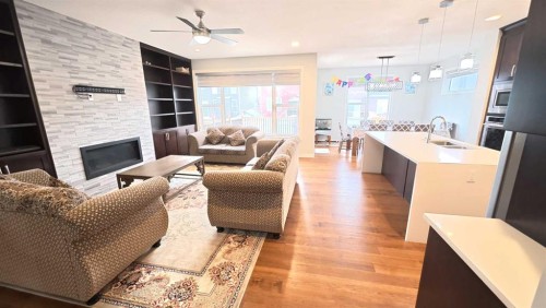 144 Red Embers Square Ne, Calgary, AB - Indoor Photo Showing Living Room With Fireplace