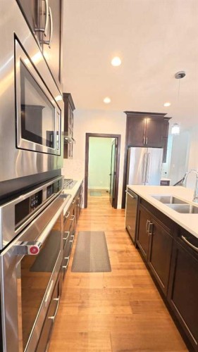 144 Red Embers Square Ne, Calgary, AB - Indoor Photo Showing Kitchen With Double Sink