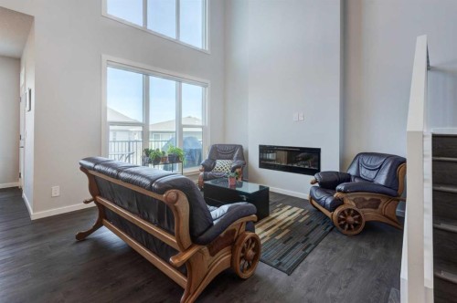 40 Verity Place Sw, Calgary, AB - Indoor Photo Showing Other Room With Fireplace
