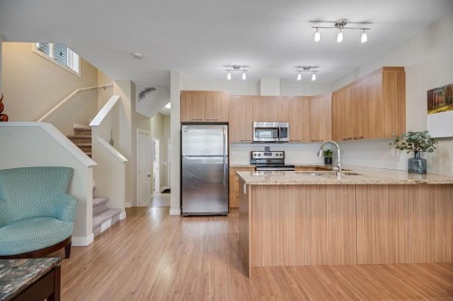 124-300 Marina Drive, Chestermere, AB - Indoor Photo Showing Kitchen With Stainless Steel Kitchen