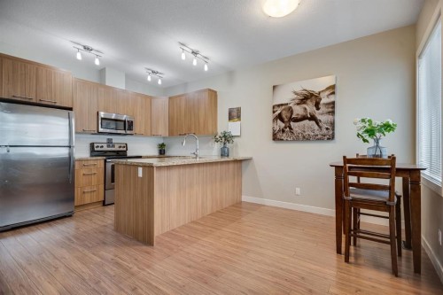 124-300 Marina Drive, Chestermere, AB - Indoor Photo Showing Kitchen With Stainless Steel Kitchen
