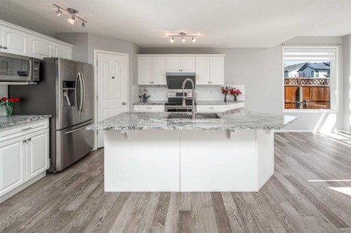 32 Cougarstone Square Sw, Calgary, AB - Indoor Photo Showing Kitchen With Stainless Steel Kitchen