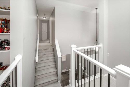 32 Cougarstone Square Sw, Calgary, AB - Indoor Photo Showing Other Room