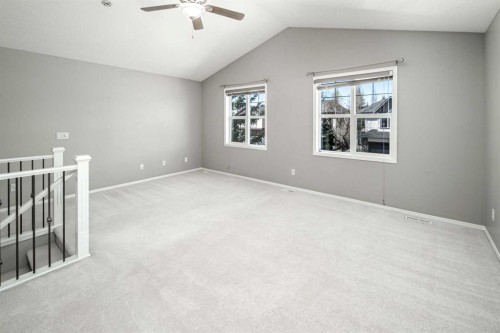 32 Cougarstone Square Sw, Calgary, AB - Indoor Photo Showing Other Room