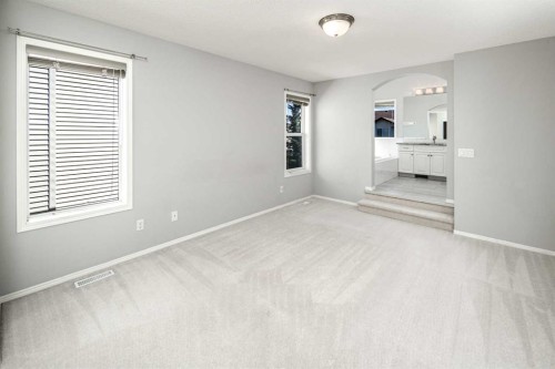 32 Cougarstone Square Sw, Calgary, AB - Indoor Photo Showing Other Room