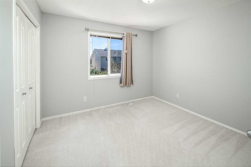 32 Cougarstone Square Sw, Calgary, AB - Indoor Photo Showing Other Room