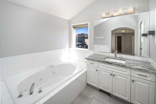 32 Cougarstone Square Sw, Calgary, AB - Indoor Photo Showing Bathroom