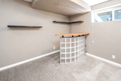 32 Cougarstone Square Sw, Calgary, AB - Indoor Photo Showing Other Room
