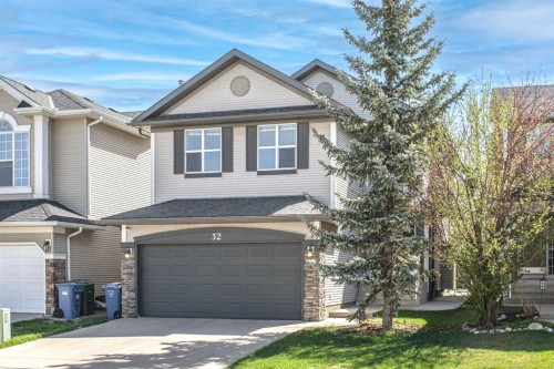 32 Cougarstone Square Sw, Calgary, AB - Outdoor With Facade