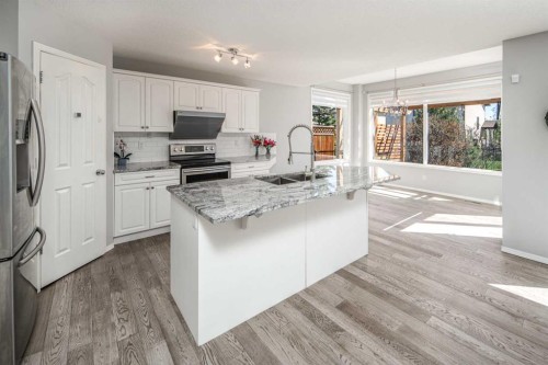 32 Cougarstone Square Sw, Calgary, AB - Indoor Photo Showing Kitchen With Double Sink With Upgraded Kitchen
