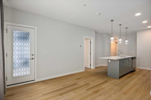 101-200 Shawnee Square Sw, Calgary, AB - Indoor Photo Showing Other Room