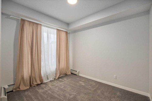 101-200 Shawnee Square Sw, Calgary, AB - Indoor Photo Showing Other Room
