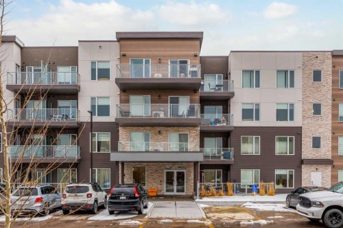 101-200 Shawnee Square Sw, Calgary, AB - Outdoor With Balcony With Facade