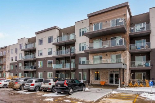 101-200 Shawnee Square Sw, Calgary, AB - Outdoor With Balcony With Facade