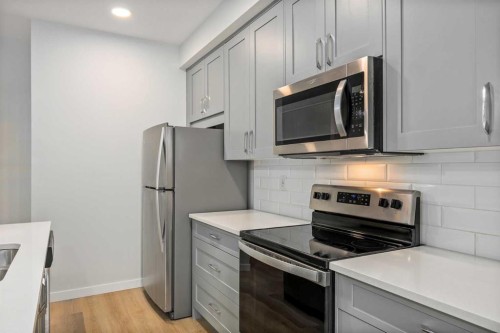 101-200 Shawnee Square Sw, Calgary, AB - Indoor Photo Showing Kitchen With Stainless Steel Kitchen