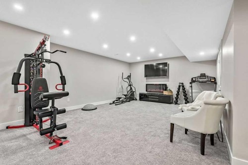 112 Kinniburgh Close, Chestermere, AB - Indoor Photo Showing Gym Room