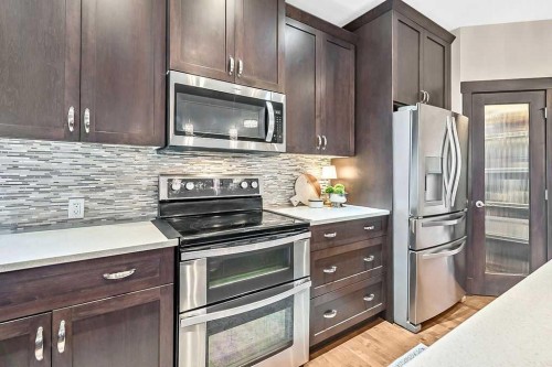 112 Kinniburgh Close, Chestermere, AB - Indoor Photo Showing Kitchen With Upgraded Kitchen