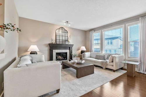 112 Kinniburgh Close, Chestermere, AB - Indoor Photo Showing Living Room With Fireplace