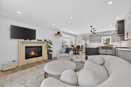 1423 18 Street Ne, Calgary, AB - Indoor Photo Showing Living Room With Fireplace