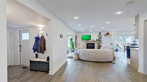 1423 18 Street Ne, Calgary, AB - Indoor Photo Showing Other Room With Fireplace