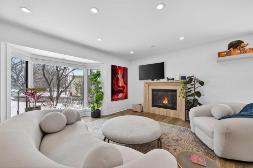 1423 18 Street Ne, Calgary, AB - Indoor Photo Showing Living Room With Fireplace