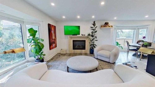 1423 18 Street Ne, Calgary, AB - Indoor Photo Showing Living Room With Fireplace