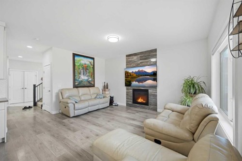 82 Legacy Glen Terrace Se, Calgary, AB - Indoor Photo Showing Living Room With Fireplace