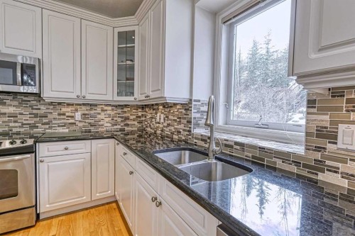 253 Patterson Boulevard Sw, Calgary, AB - Indoor Photo Showing Kitchen With Double Sink With Upgraded Kitchen