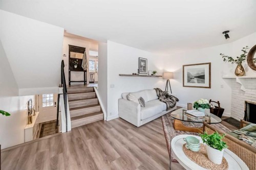 60 Point Drive Nw, Calgary, AB - Indoor Photo Showing Living Room With Fireplace