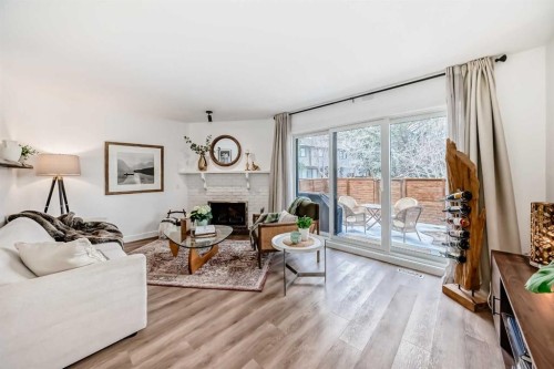 60 Point Drive Nw, Calgary, AB - Indoor Photo Showing Living Room With Fireplace