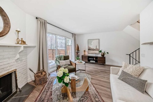 60 Point Drive Nw, Calgary, AB - Indoor Photo Showing Living Room With Fireplace