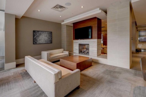 246-222 Riverfront Avenue Sw, Calgary, AB - Indoor Photo Showing Other Room With Fireplace