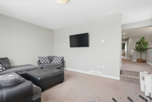 99 Sunset View, Cochrane, AB - Indoor Photo Showing Living Room
