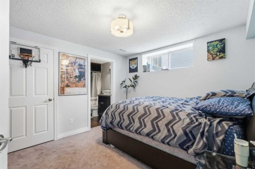 99 Sunset View, Cochrane, AB - Indoor Photo Showing Bedroom