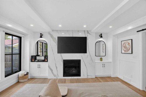 648 Willingdon Boulevard Se, Calgary, AB - Indoor Photo Showing Living Room With Fireplace