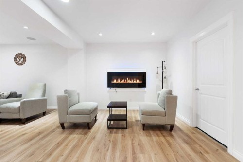 99 Evansglen Circle Nw, Calgary, AB - Indoor Photo Showing Living Room With Fireplace