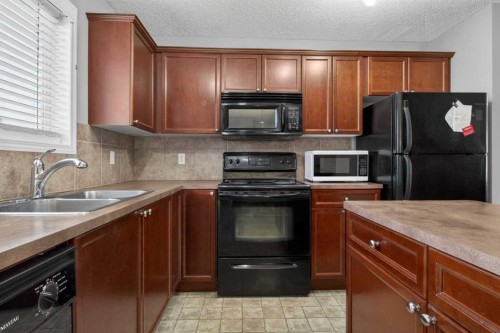 135 Copperstone Grove Se, Calgary, AB - Indoor Photo Showing Kitchen With Double Sink