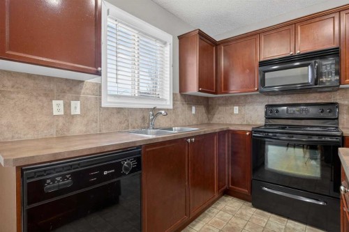 135 Copperstone Grove Se, Calgary, AB - Indoor Photo Showing Kitchen With Double Sink
