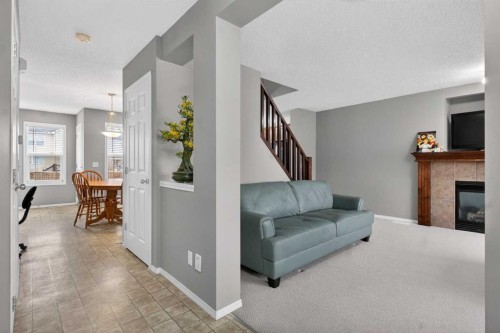 135 Copperstone Grove Se, Calgary, AB - Indoor Photo Showing Living Room With Fireplace