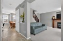 135 Copperstone Grove Se, Calgary, AB  - Indoor Photo Showing Living Room With Fireplace 