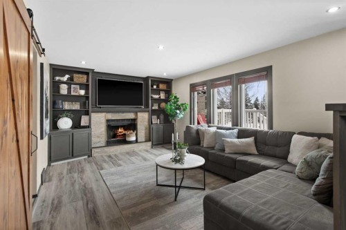 48 Rivergreen Crescent Se, Calgary, AB - Indoor Photo Showing Living Room With Fireplace
