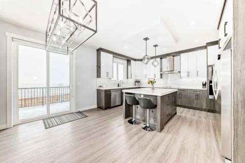 82 Waterford Crescent, Chestermere, AB - Indoor Photo Showing Kitchen With Upgraded Kitchen